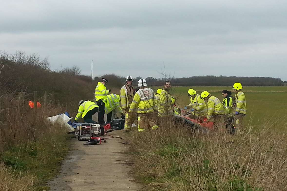 Fire crews cut the driver out of the mangled car