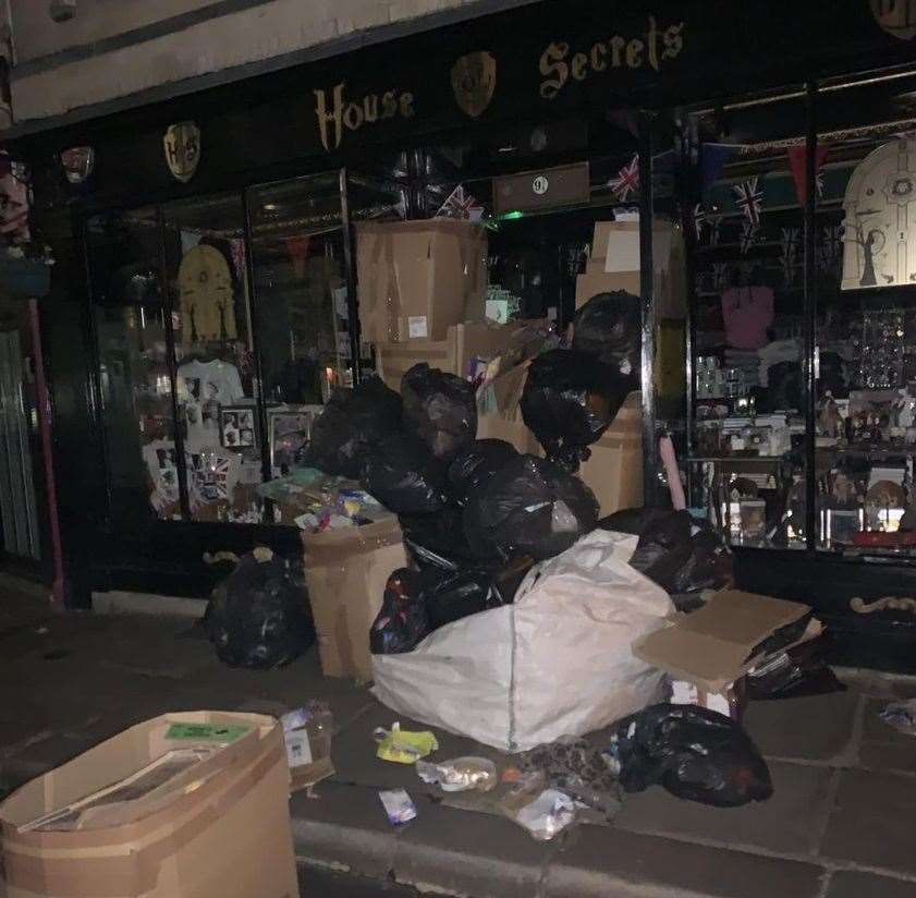 A huge pile of rubbish was left outside the Harry Potter-themed House of Secrets shop in Canterbury last night. Picture: Megan Rogers
