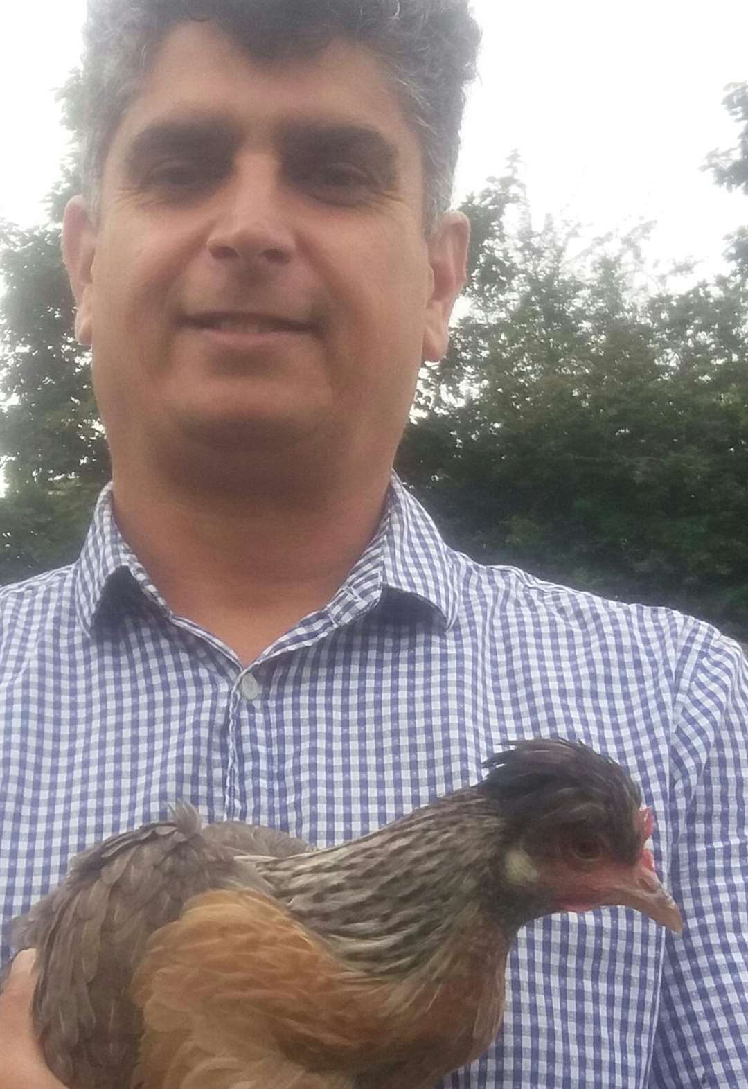 Councillor Aram Rawf with his new chicken Jeremy Corbyn