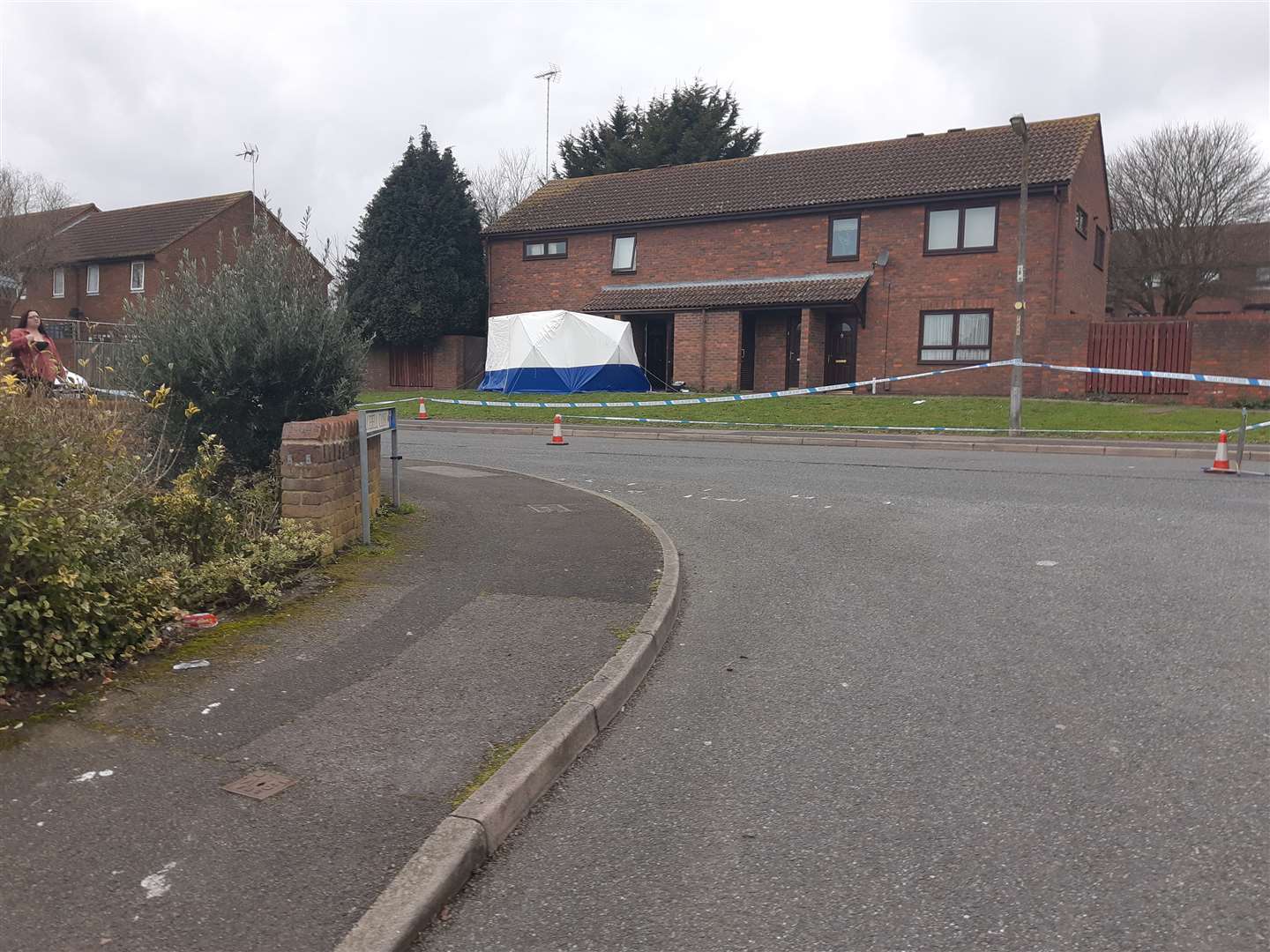 A police cordon remains across the block of flats in Firethorn Close, The Vineries
