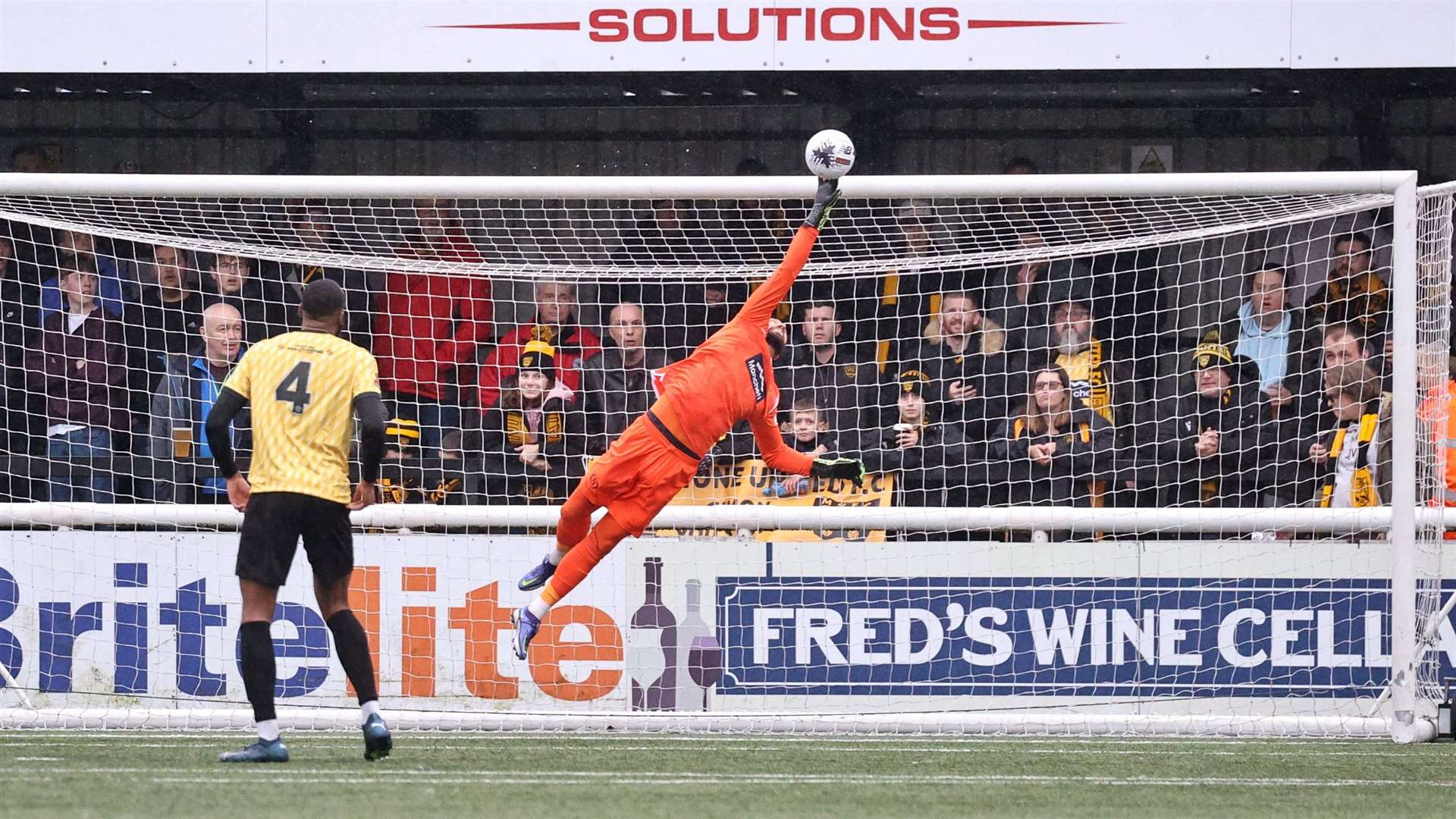 Maidstone keeper Lucas Covolan makes a flying save from Joe Re. Picture: Helen Cooper