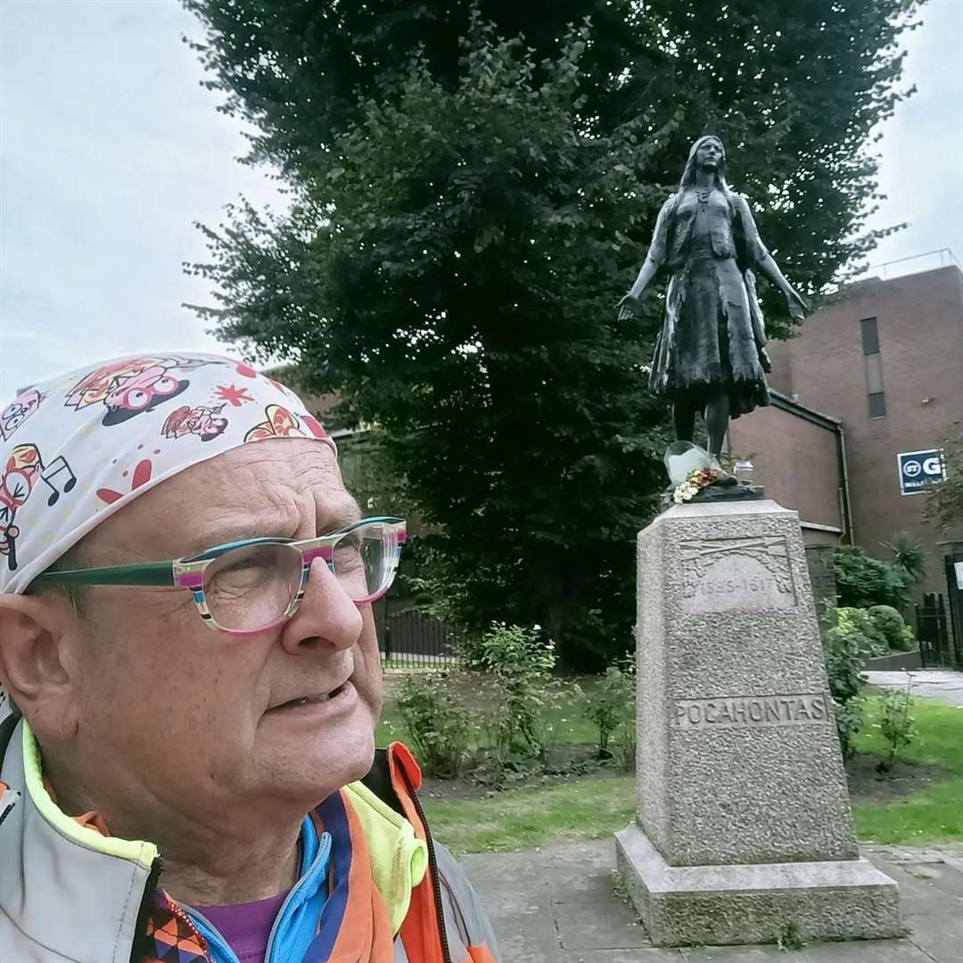 Former children's TV presenter Timmy Mallett in St George's churchyard, Gravesend, with the statue of Princess Pocahontas. Copyright Timmy Mallett timmymallett.co.uk