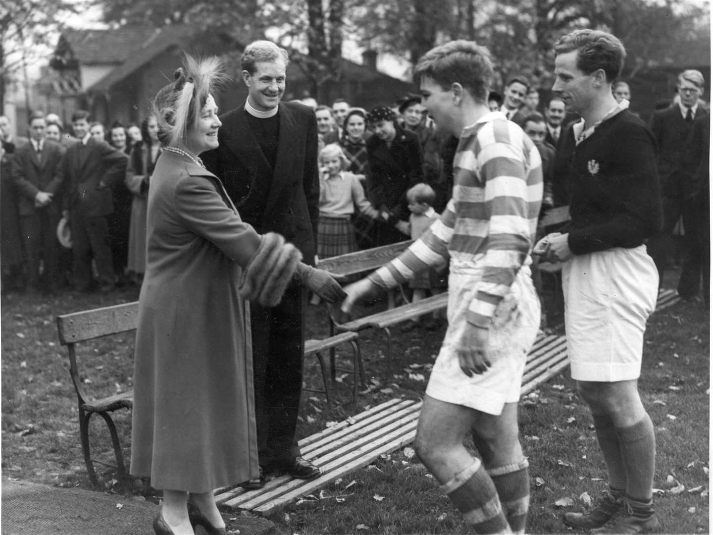 These rugby players met the Queen Mother when she visited Tonbridge School and opened a memorial gateway to mark its 400th anniversary in October 1953