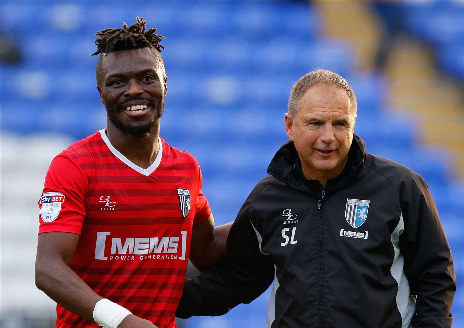 Former Peterborough player Gabriel Zakuani and Gills boss Steve Lovell celebrate a win at the ABAX Stadium in October, 2017 Picture: Andy Jones