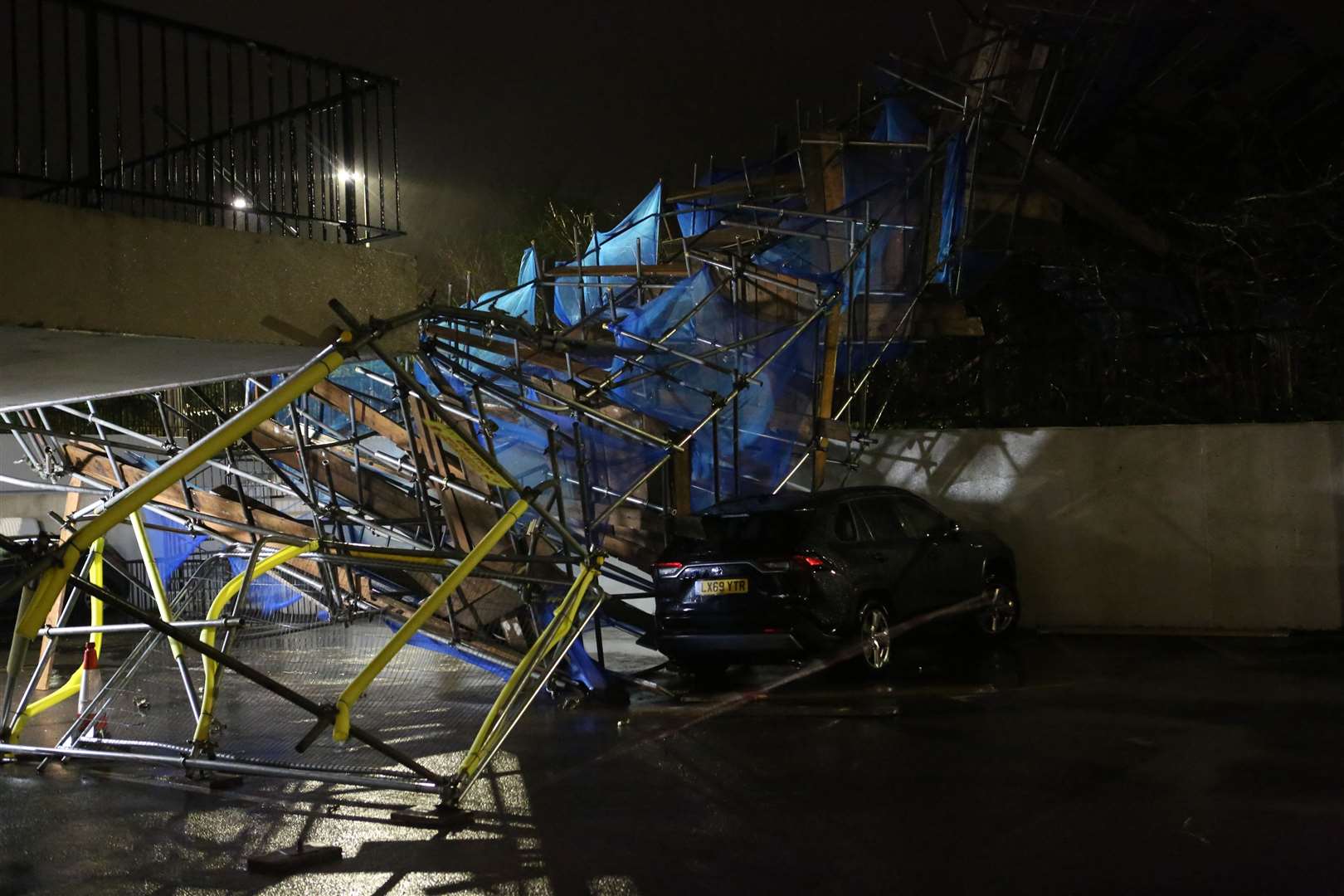 This scaffolding tower fell onto cars in Orpington during last night's storm, forcing the closure of Chelsfield Lane. Picture: UKNIP
