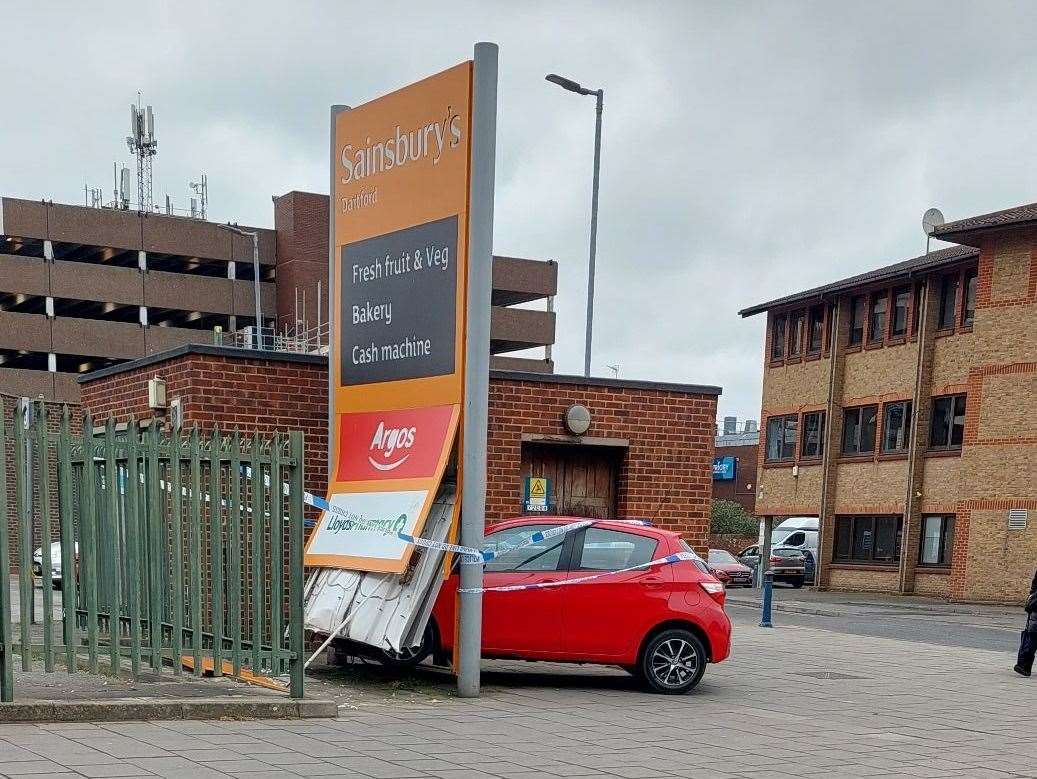 The car was taped off after it crashed into the Sainsbury's sign in Dartford