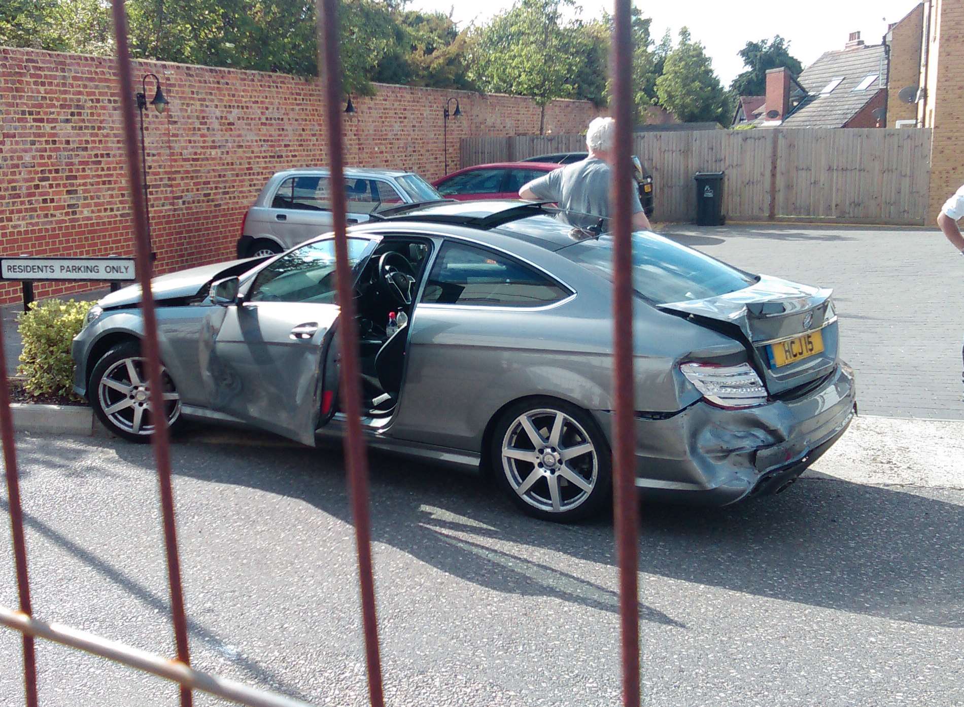 A car was said to have collided with the woman, and several parked cars