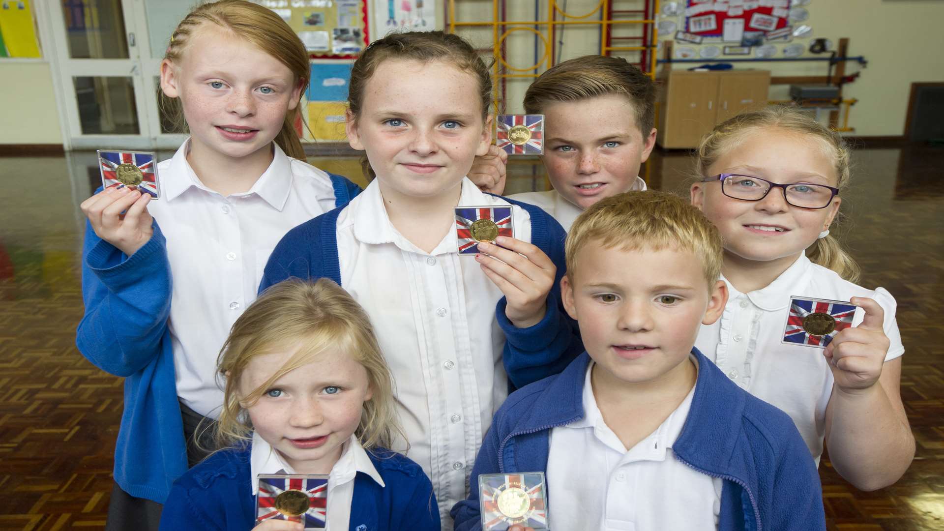 From left, back, Gracie, 10, Lola, 10, Joe, 10, and Ellie, 8. Front are Lacey, 6, and Alek, 7. Pupils of Halfway Houses Primary School, Halfway, Sheppey, are being presented with commemorative coins to mark the Queen becoming the longest reigning English monarch.