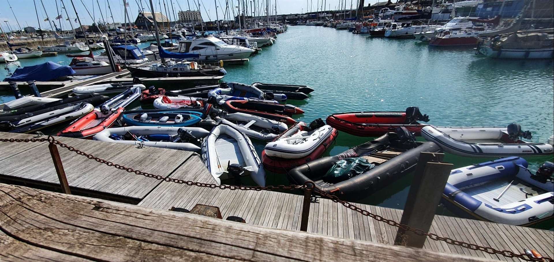 A stash of abandoned dinghies and canoes at Dover marina, pictured today
