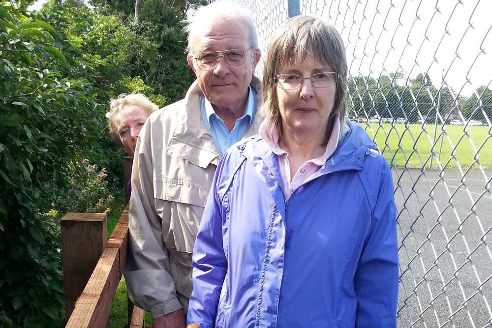 Ruth Colman (front), Richard Coleman and tennis club secretary Jenny Waterman (head) on the narrowed path.