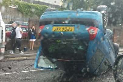 A car on its roof in New Road, Chatham. Picture: @tunneldave