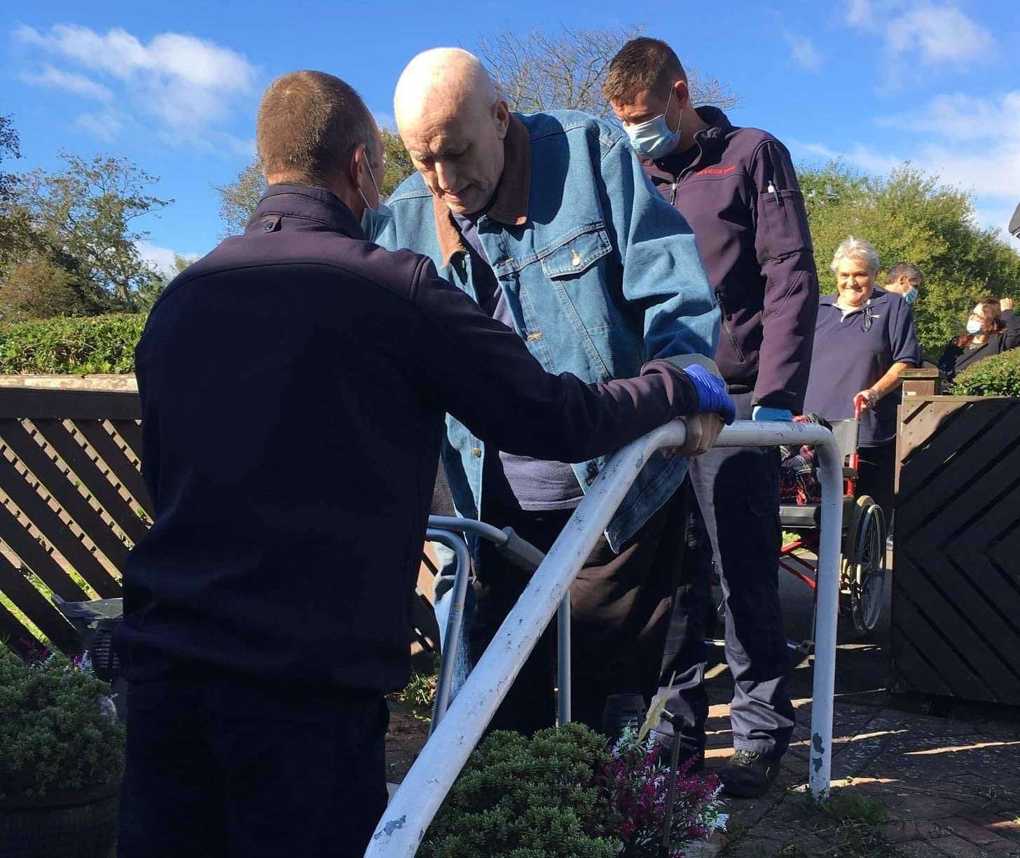 Gordon Foreman, 77, is helped down his steps at his home in Whitstable. Picture: Sylvia Foreman