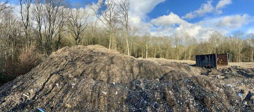 Rubbish is piled 12ft high across part of Hoad’s Wood, near Ashford