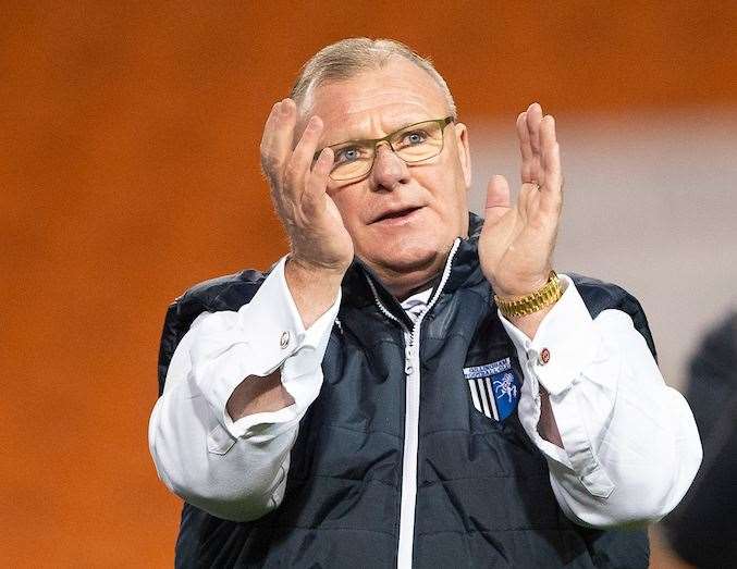 Steve Evans applauds the fans after their dramatic win at Blackpool Picture: Ady Kerry (29001892)