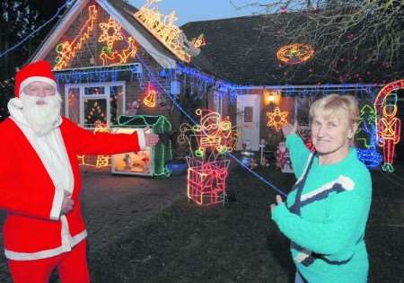Derek and Peggy Lucas outside their illuminated home in Chestfield Road last year. Is this a thing of the past?
