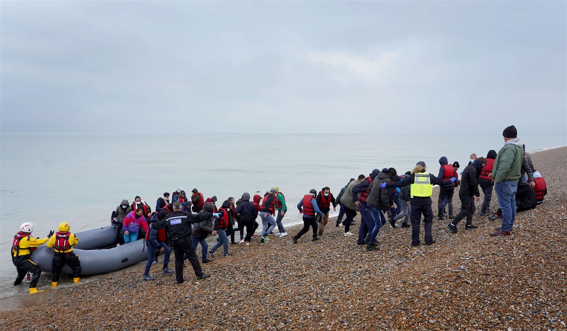 A group of people arrive at Dungeness, Kent (Gareth Fuller/PA)