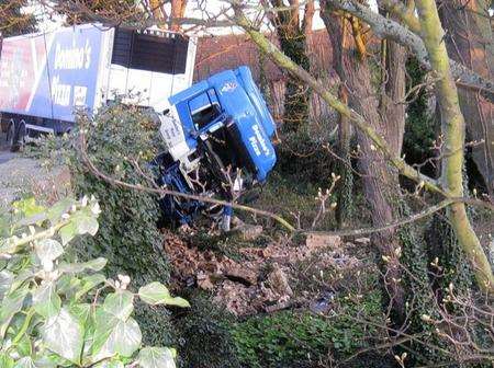 The Domino's Pizza lorry was hanging over the hole it had created on a railway bridge at Deal.