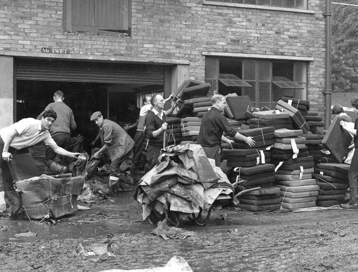 Clearing up after a flood at The Len Cabinet Works