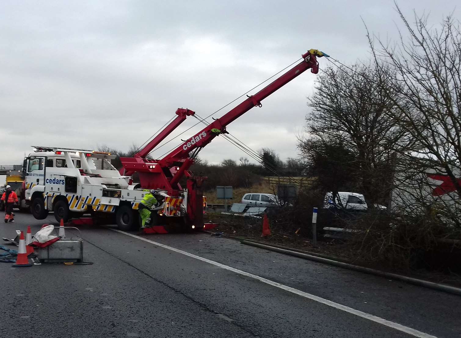 The road remains closed as specialist recovery crews try to get the lorry out of the ditch. Picture: Highways England