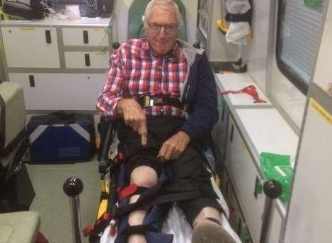 Len Hinksman in the back of the ambulance after his fall