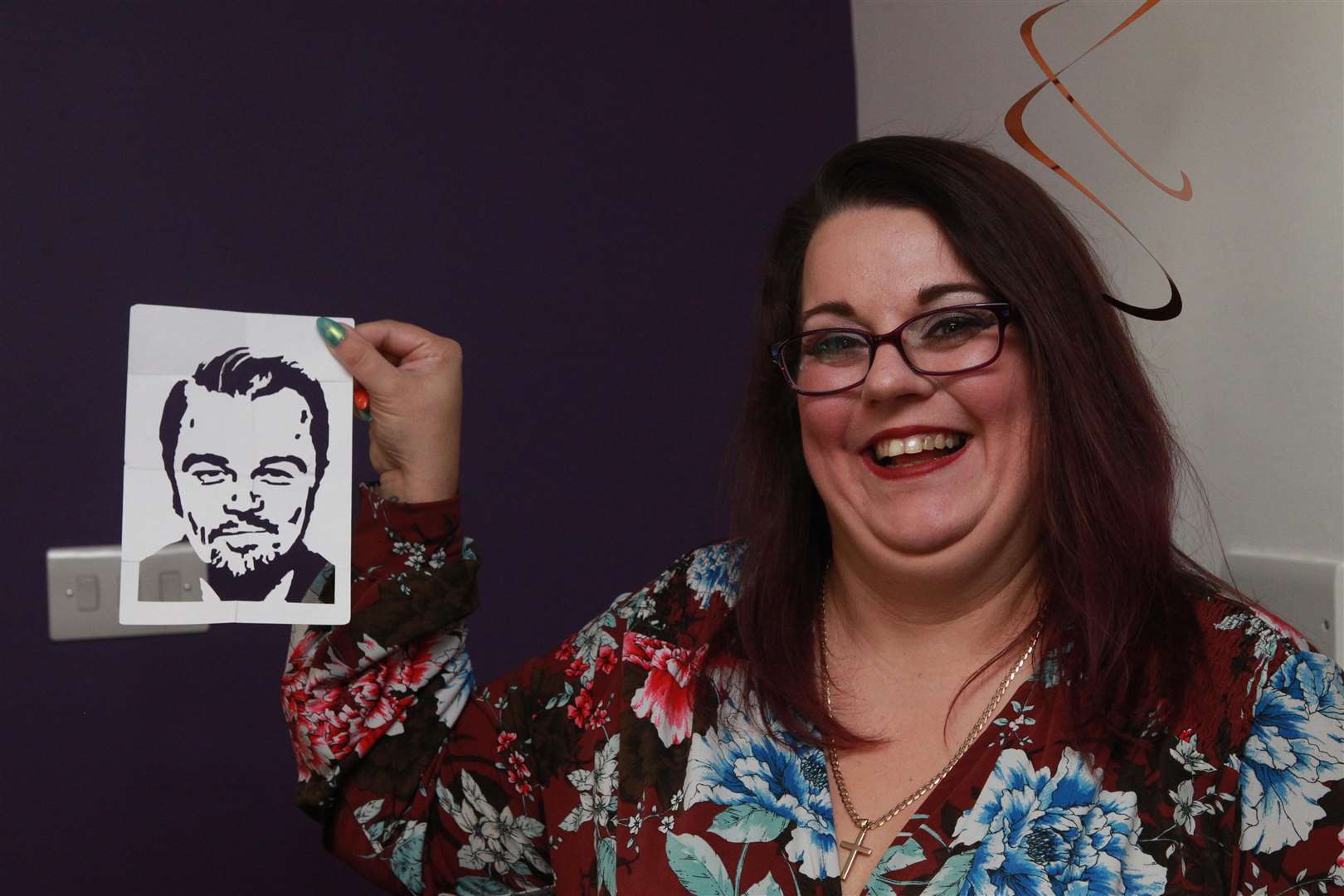 Steff Weller, a Mother and visitor shows a picture of Leonardo DiCaprio, made from origami by Richard Jones winner of Britain's Got Talent, a couple of years ago, he used for a magic trick, during the show children and family at Demelza Hospice Care for Children. Picture by: John Westhrop (5050898)