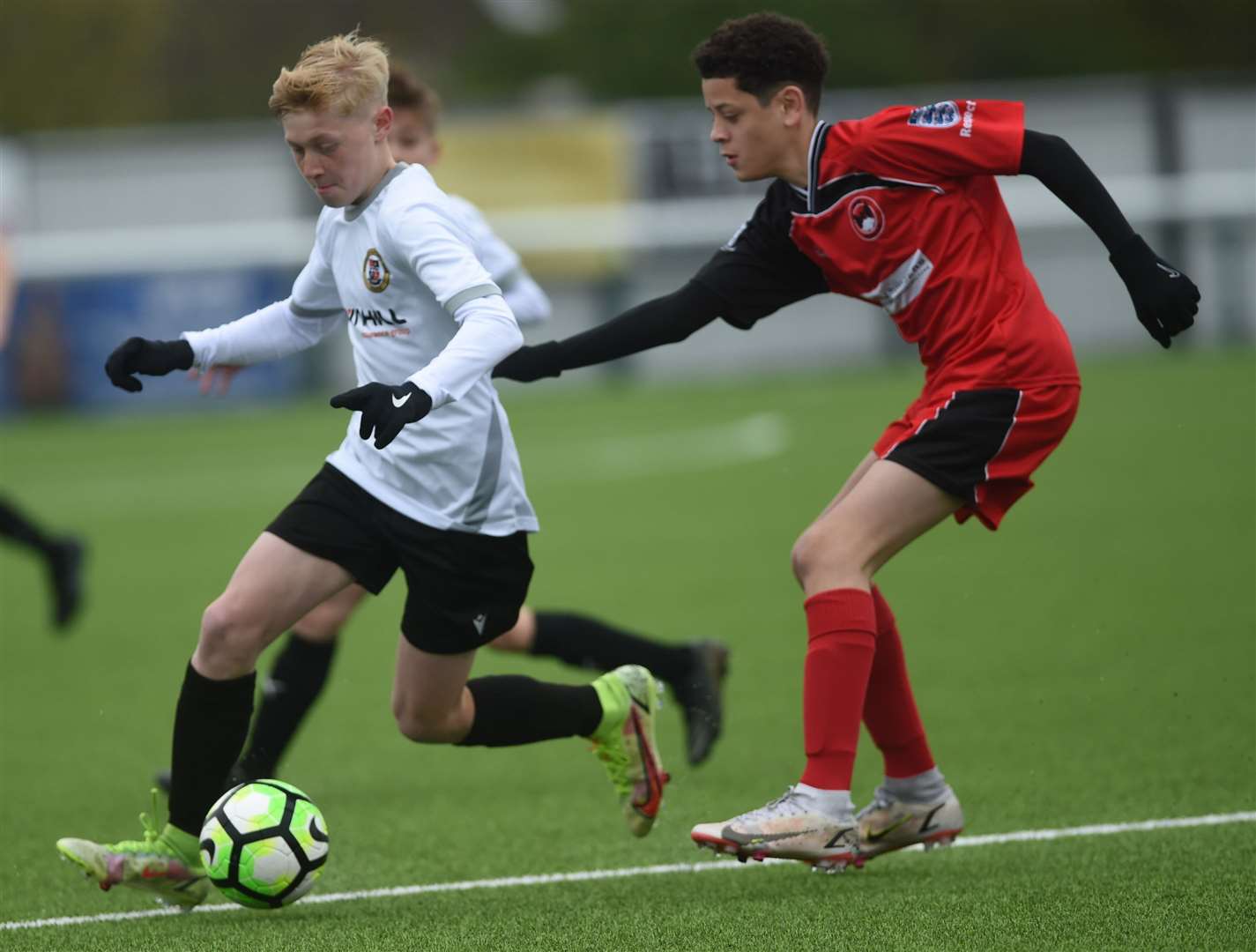 Bromley under-13s (white) are closed down by Phoenix Sports under-13s. Picture: PSP Images