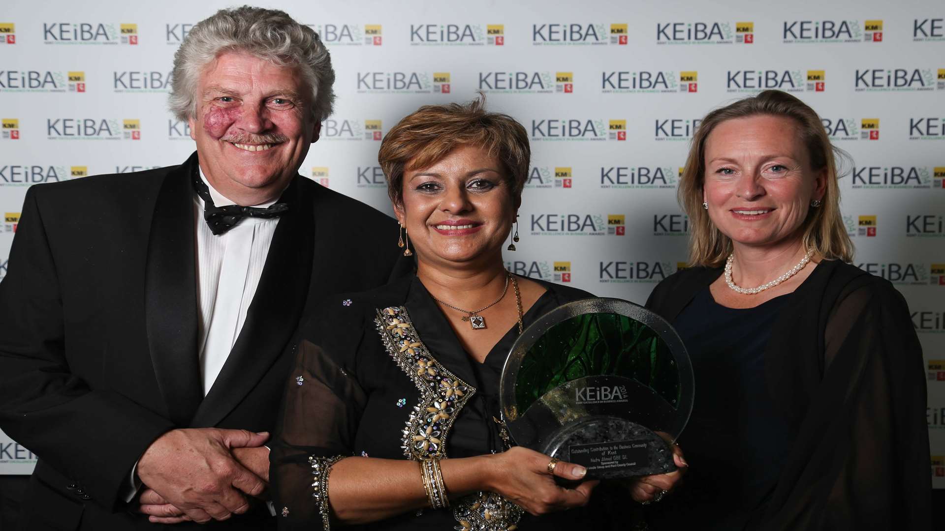 KCC's Mark Dance, left, with Outstanding Contribution to the Business Community of Kent award Nadra Ahmed MBE DL, centre, and KM Group chairman Geraldine Allinson