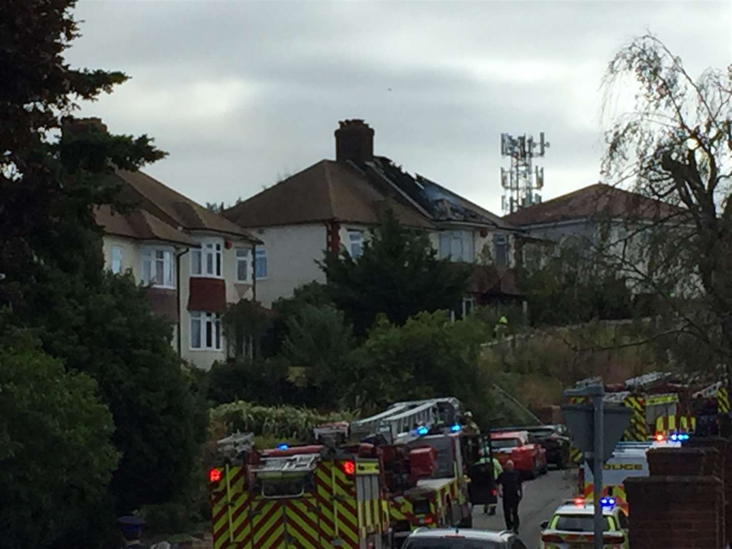 Firefighters and police at the scene of the fire in Broom Hill Road, Strood. Pictures: Brad Harper
