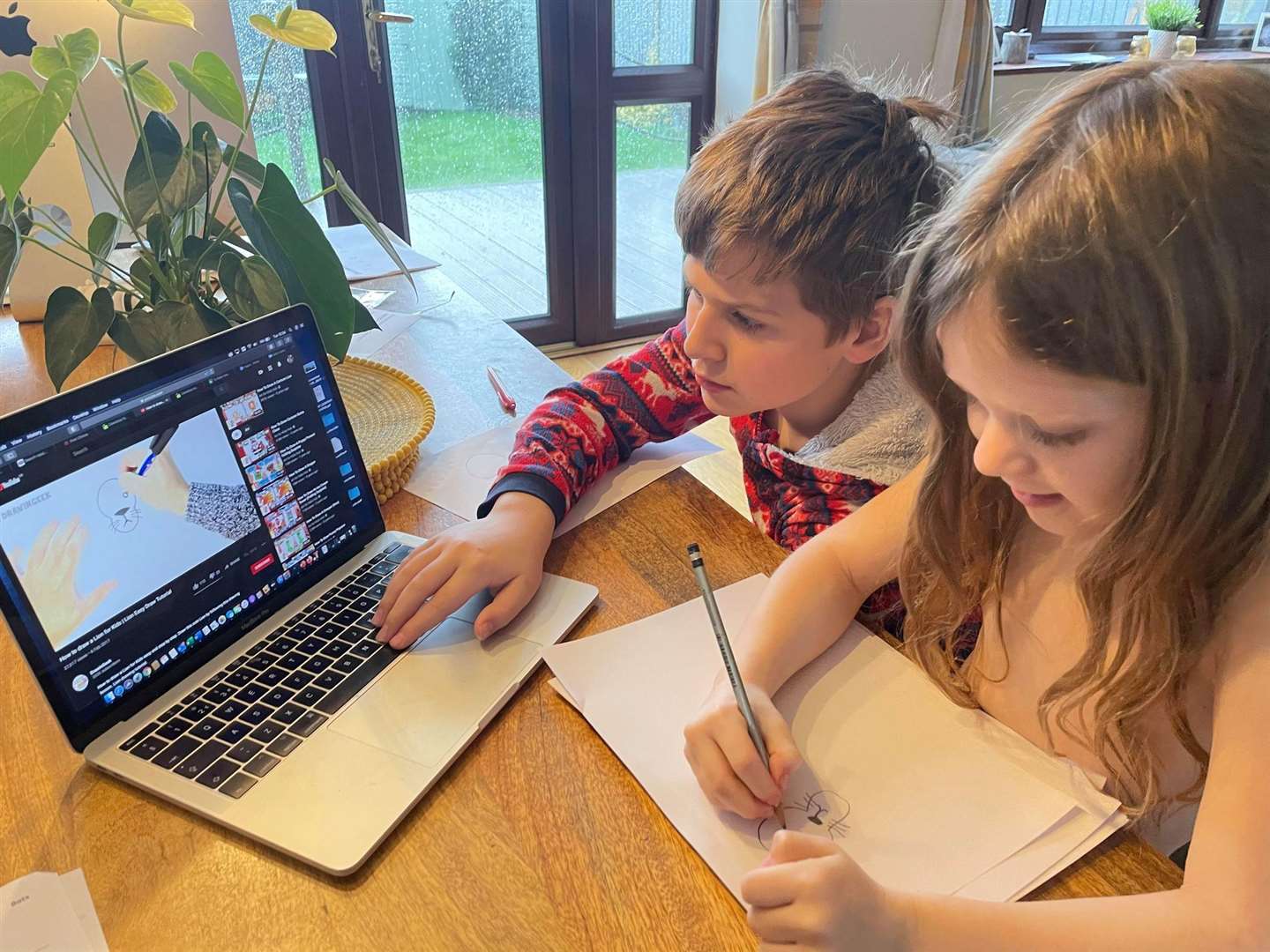 Thomas Lawrence, 11, and his sister Isabella, six, doing school work at home on the Isle of Sheppey (43885002)
