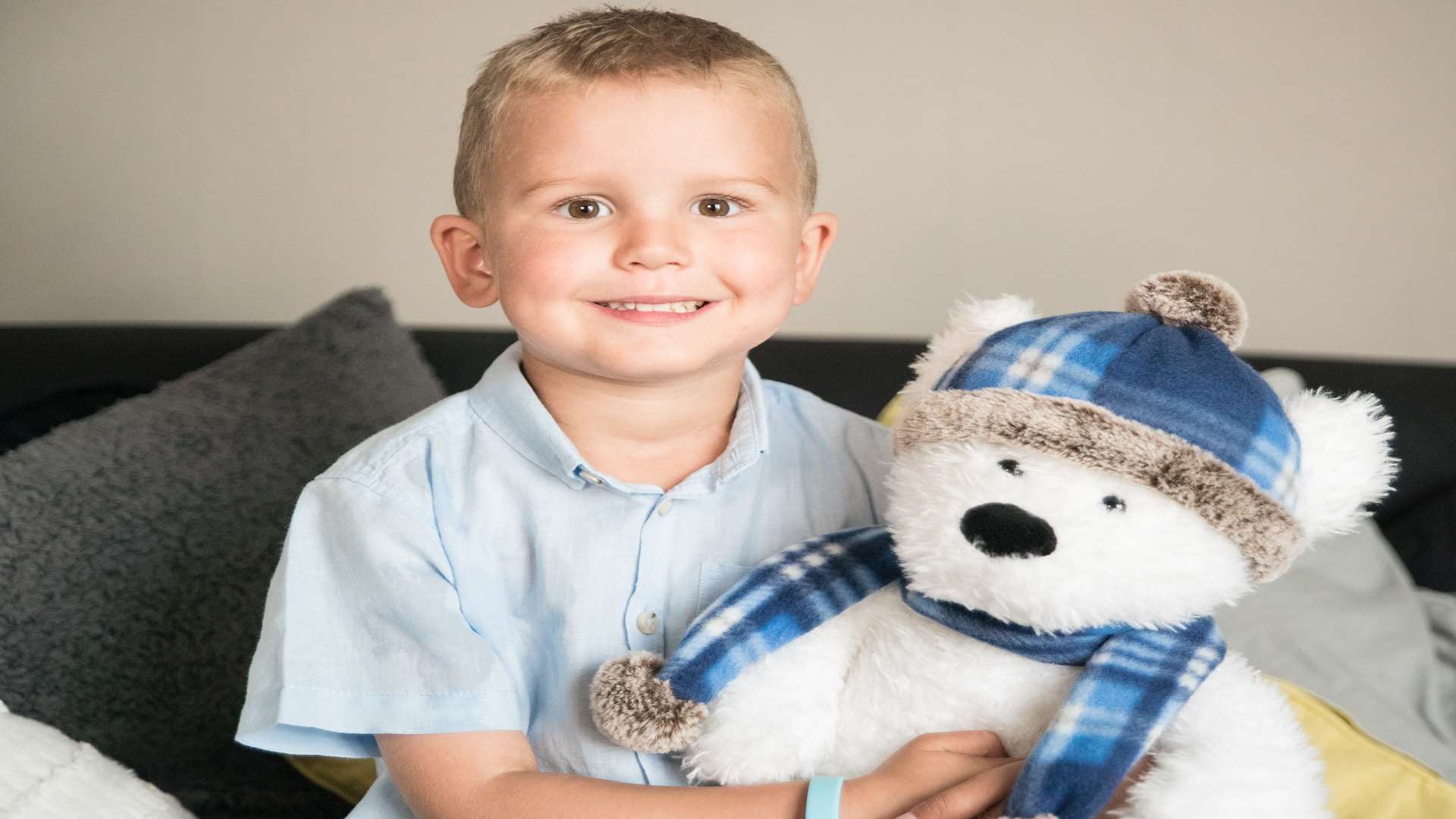 Harry Lucas with his CLIC Sargent Jasper the bear.