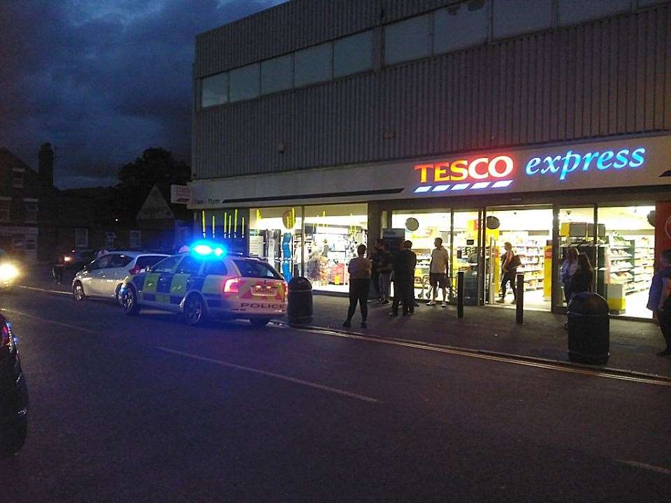 Police presence outside Tesco Express in Foord Road. Picture Kent_999s
