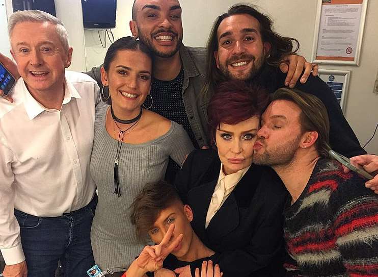James Johnson (bottom centre) with judges Louis Walsh and Sharon Osbourne and some of the crew backstage