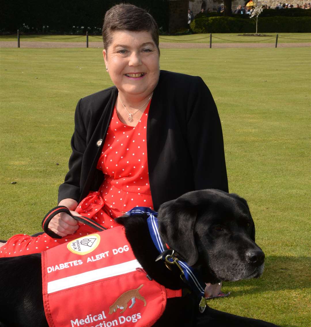 Pal the medication detection dog with owner Claire Pearson at Leeds Castle on Wednesday. Picture: Chris Davey... (8747512)
