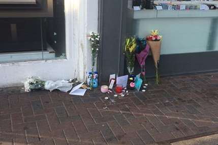 Floral tributes were left in Week Street