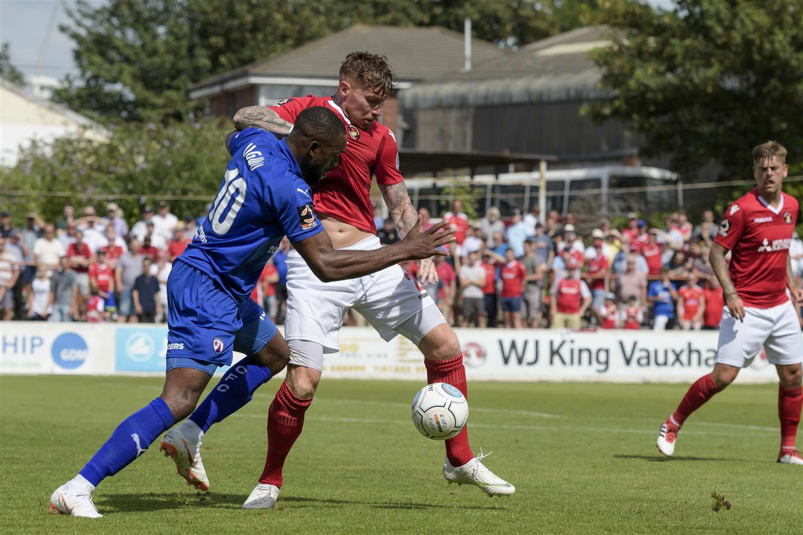Jack King tackles Chesterfield's Gozie Ugwu on the opening day of the season Picture: Andy Payton
