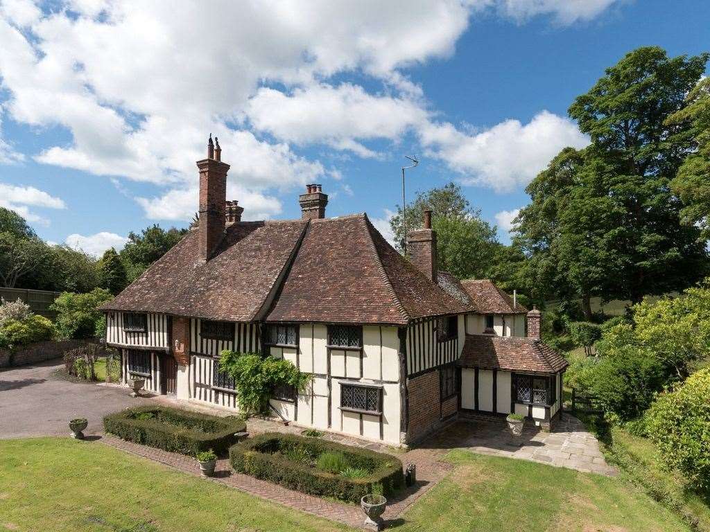 Towering trees surround an expansive garden of roses and lavender. The property has an estimated value of £1.4M, making it the fifth most expensive on Sandling Road. Photo: Zoopla