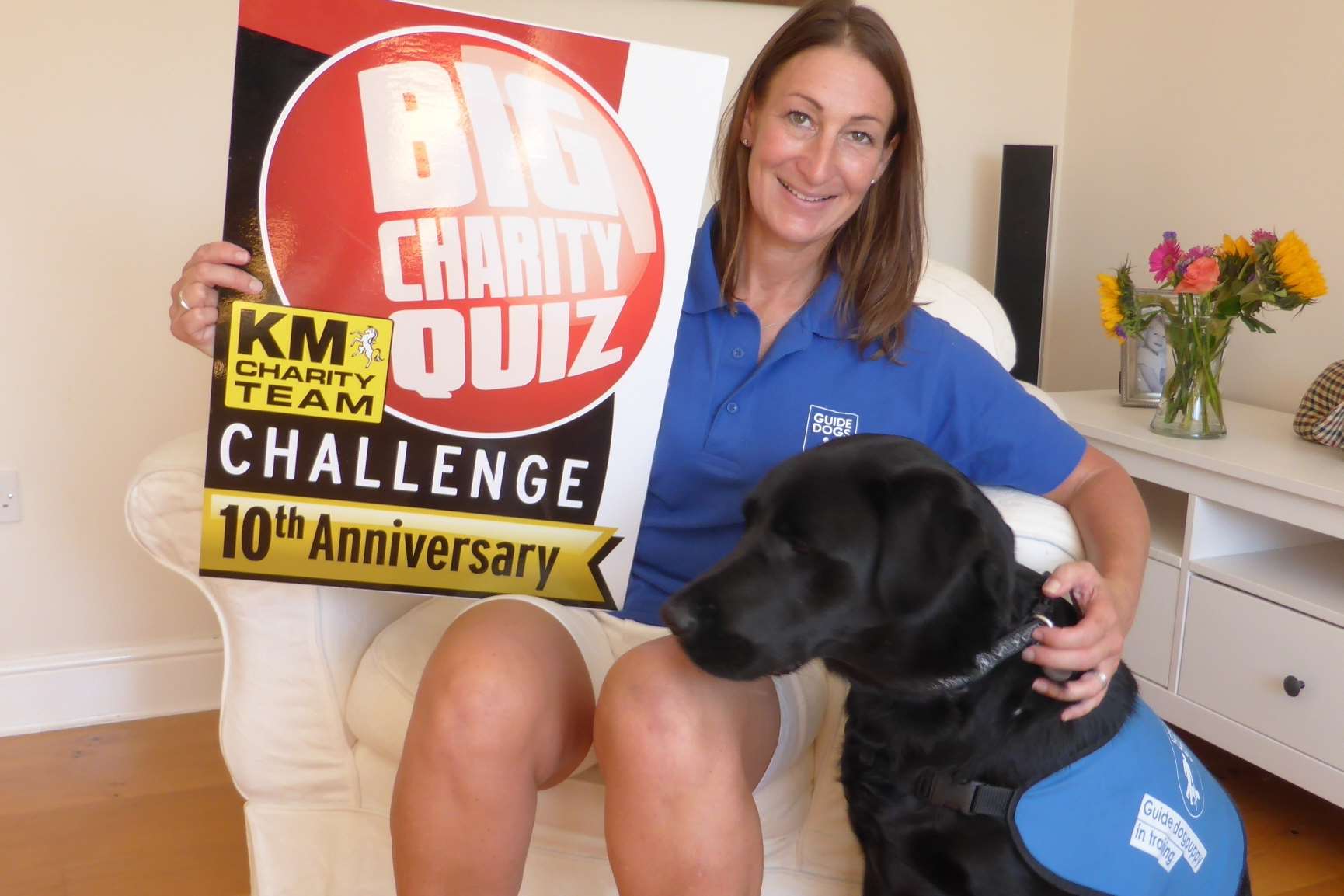Susie New from Guide Dogs for the Blind pictured with Milo the dog urges teams to join in the Ashford Big Charity Quiz.
