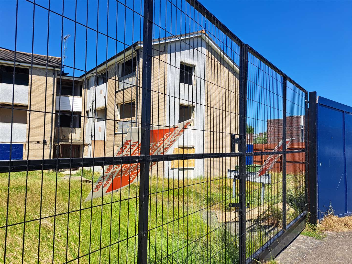 There are no windows to the old flats which has also been fenced off