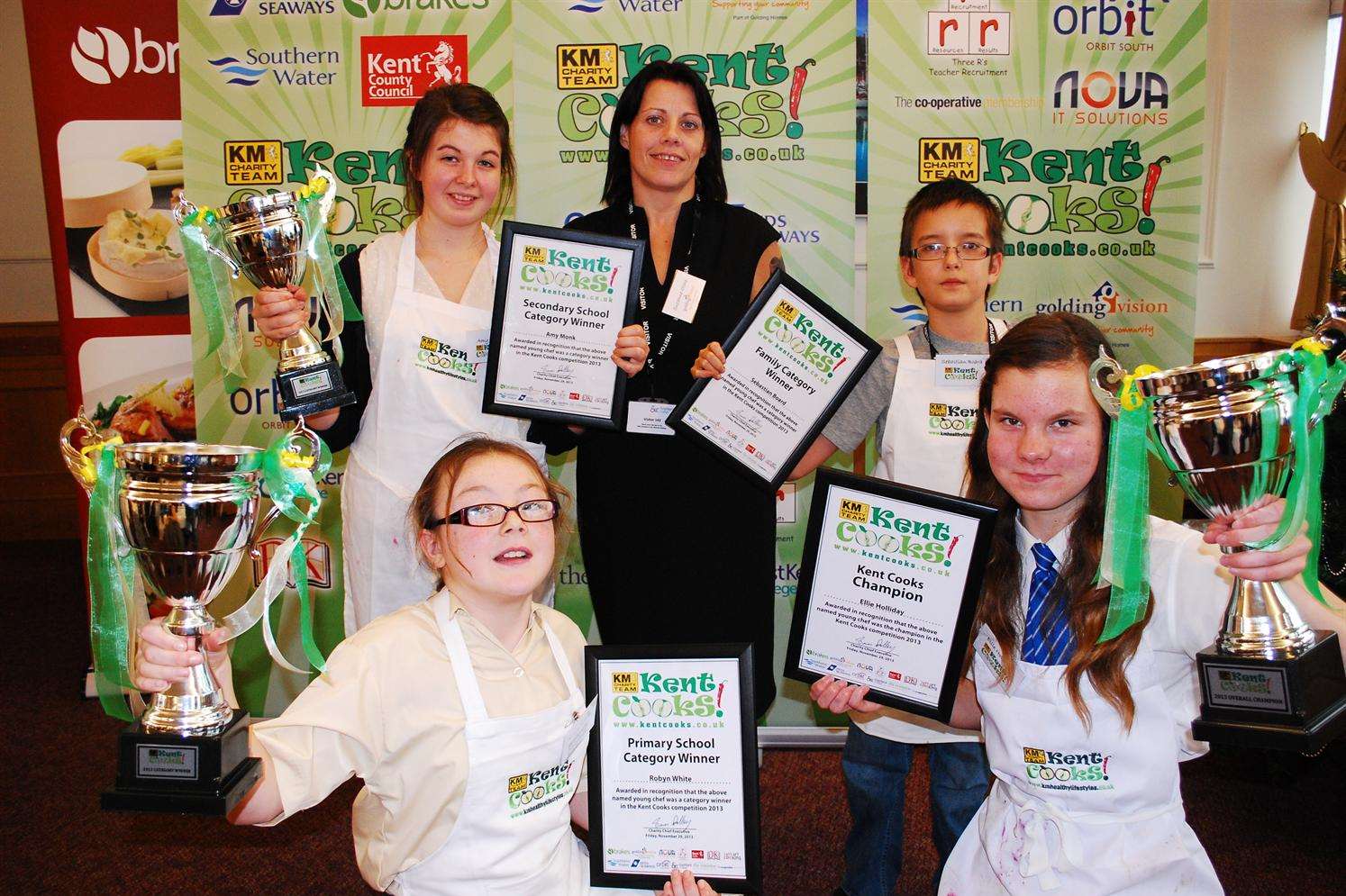 Kent Cooks 2013 category winners from left; secondary winner Amy Monk from Maidstone, primary winner Robyn White from Thanet, judge Suzanne Stone from Golding Homes, family category winner Sebastian Board from Maidstone and overall winner Ellie Holliday from Whitstable