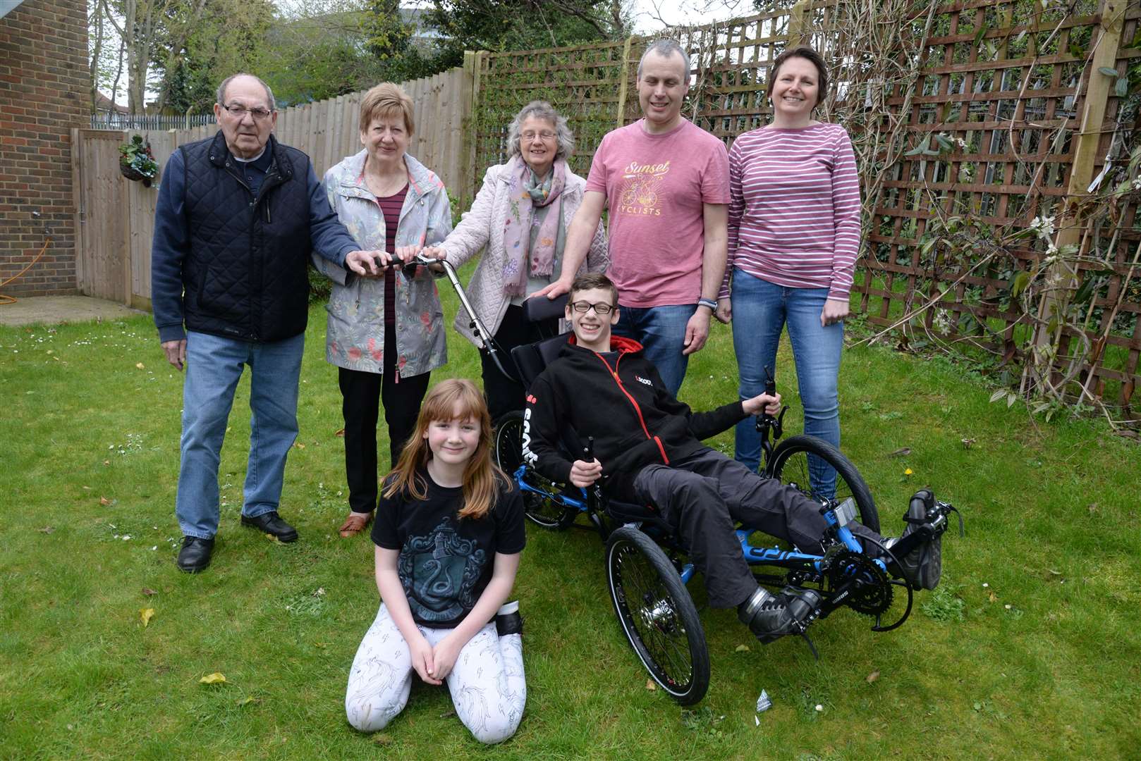 Nathaniel Hurley with grandparents, parents and sister Alex and his new tricycle. Picture: Chris Davey. (8510590)
