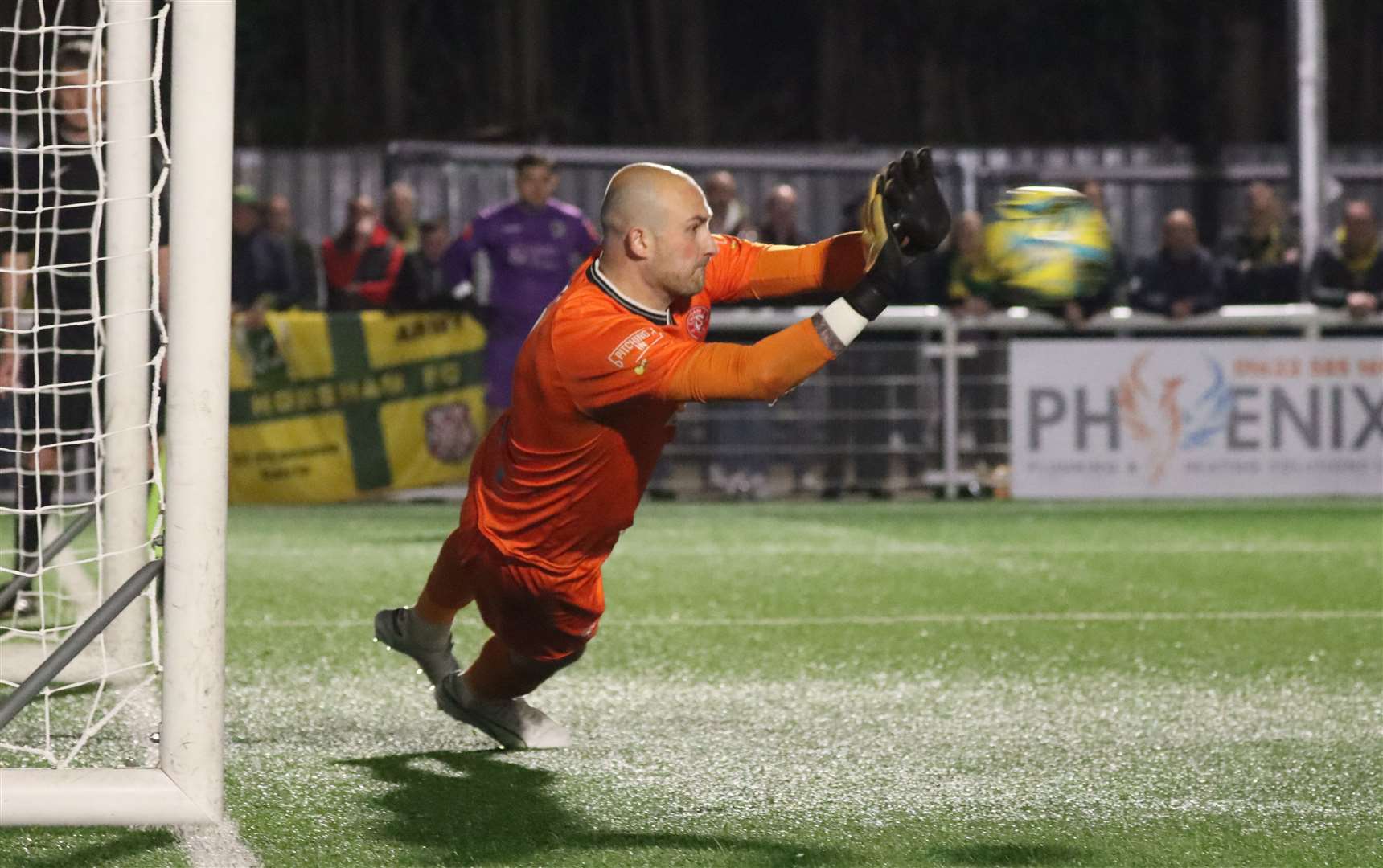 Mitchell Beeney goes the right way to save for Chatham Town Picture: Max English