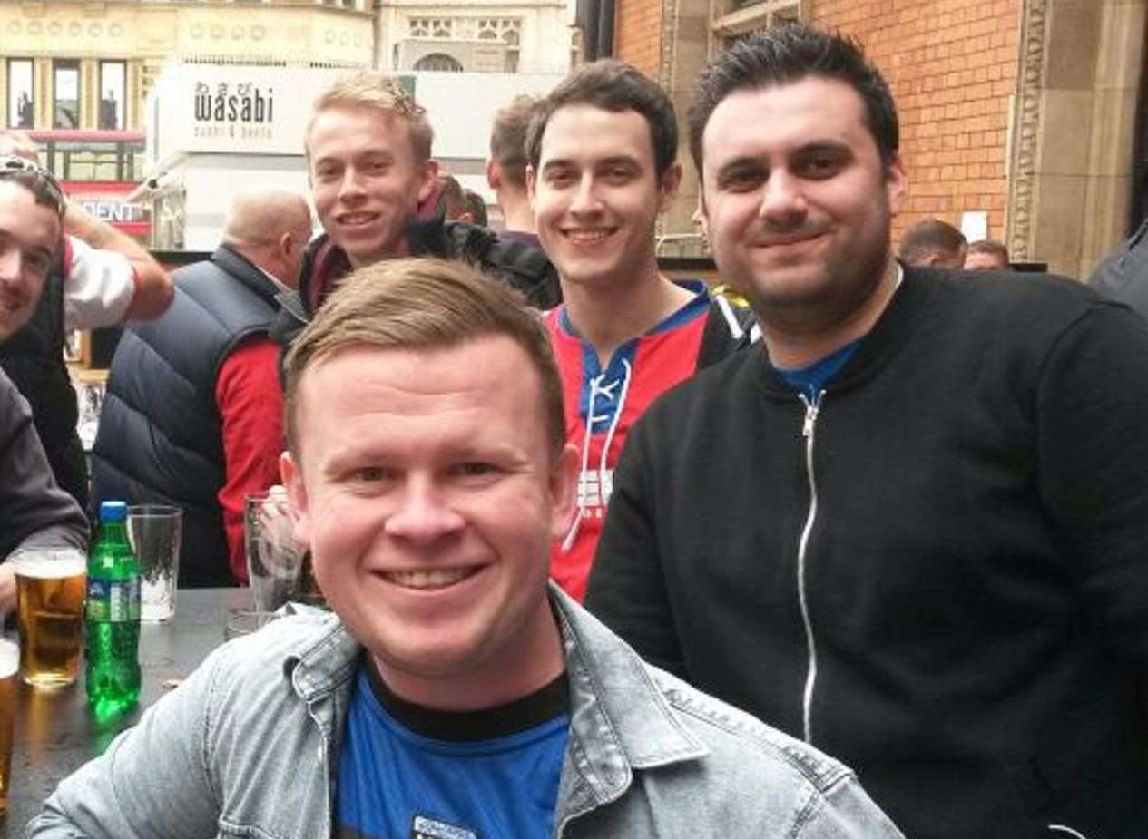 Chris and Darius enjoying a drink with fellow Gills fans