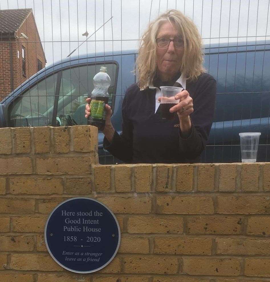 Former landlady Karen Woebley raises a glass