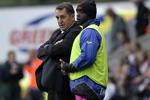 Martin Allen in discussions with Adebayo Akinfenwa at Shrewsbury on Saturday. Picture: Barry Goodwin