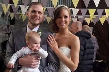 The happy couple with their 11-month-old daughter Polly