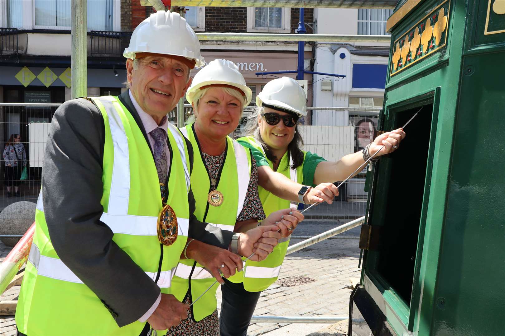 Swale's mayor Paul Stephen, with his wife Sarah and Cllr Monique Bonney, right, had the honour of being the first to ring the bell in the refurbished Sheerness clock tower. Picture: John Nurden