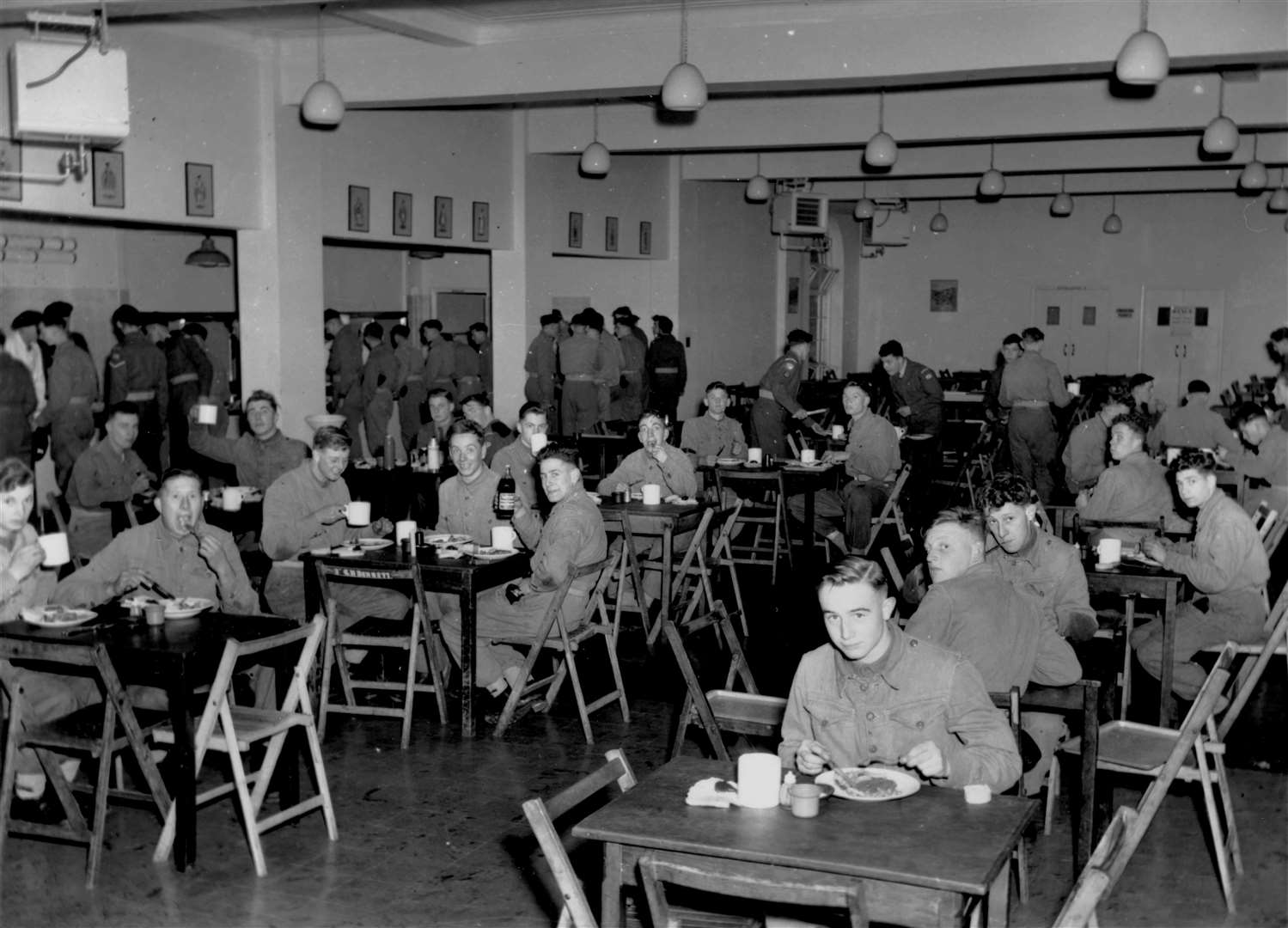 Troops in the new dining hall and kitchen at The Buffs Depot in Canterbury in December 1953. The barracks were later renamed Howe Barracks and in 2016 the land was purchased by Taylor Wimpey, who have since built hundreds of homes on the site, known as Royal Parade
