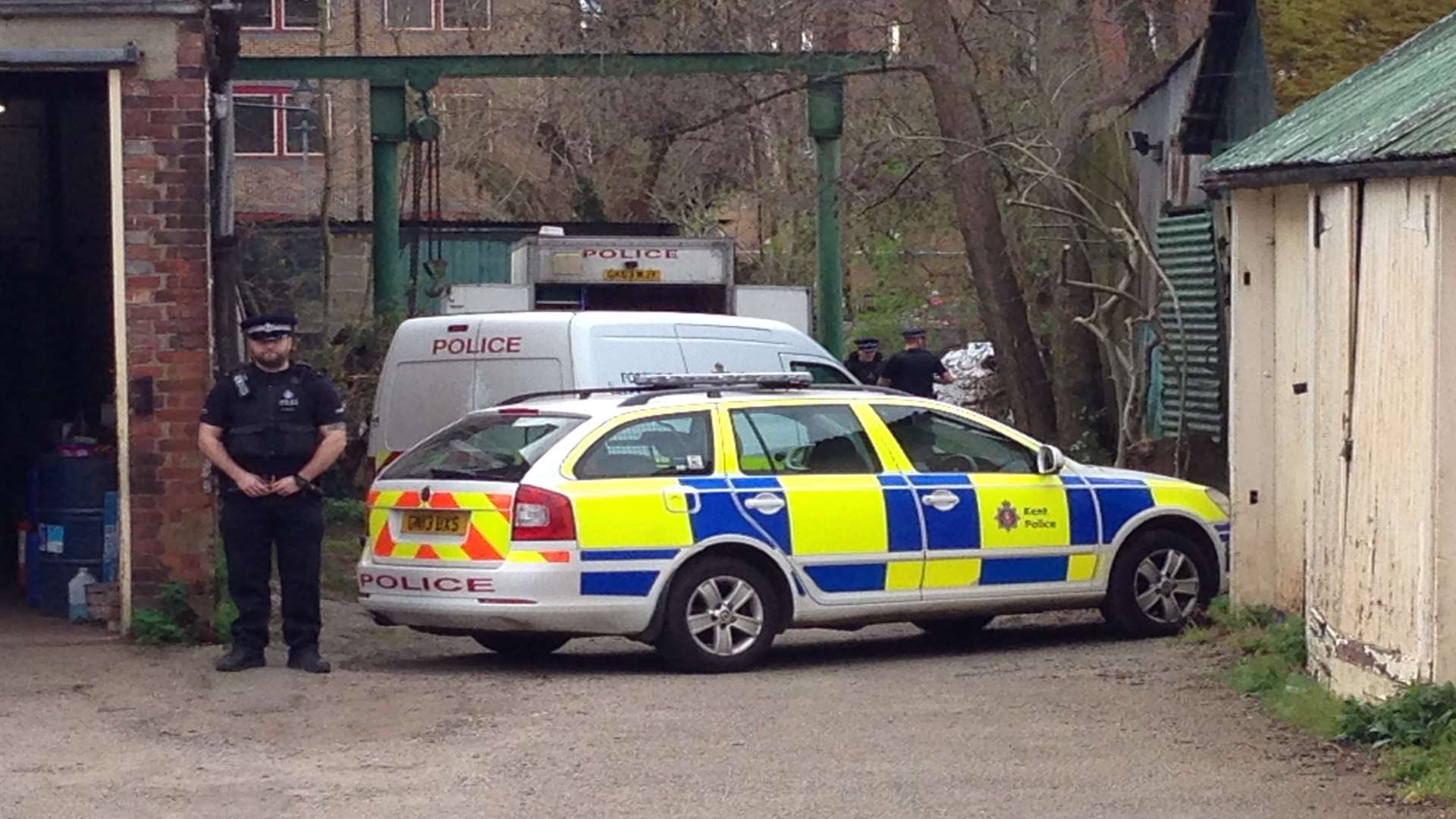 Police at the scene where a body was found in the River Medway at Tonbridge earlier today