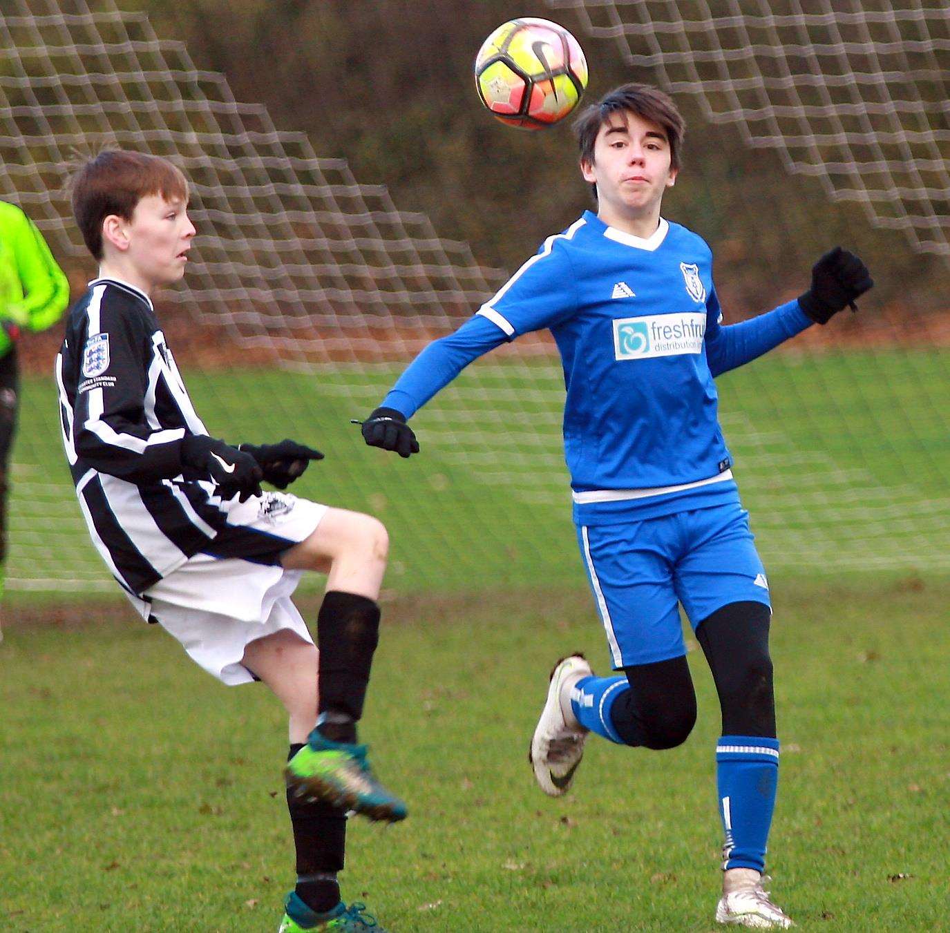 Milton and Fulston (stripes) got the better of New Road in Under-14 Division 2 Picture: Phil Lee