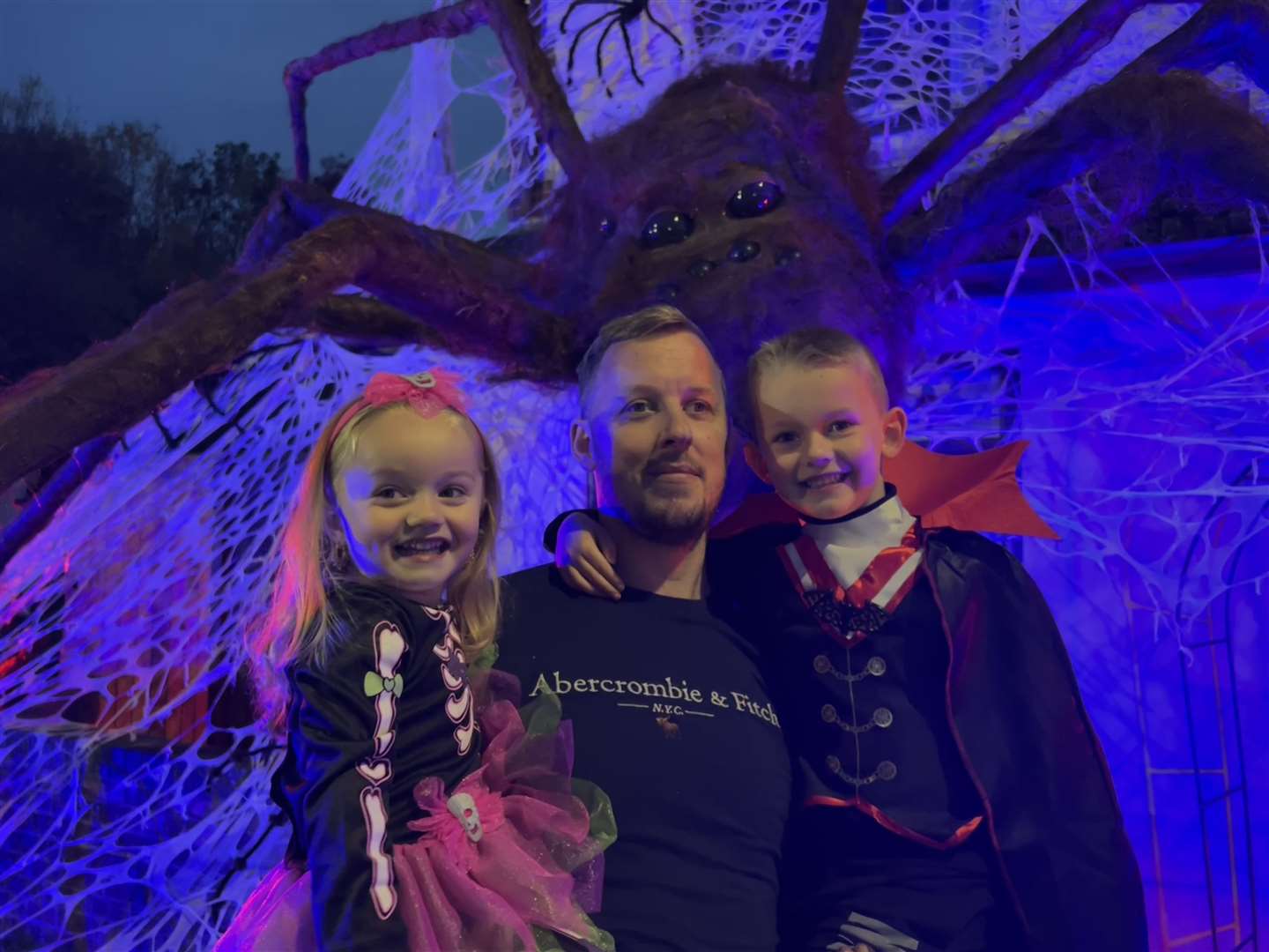 Kieron King with Scarlett and Charlie Cross, outside the haunted house in Lower Rainham Road. Picture: Megan Carr